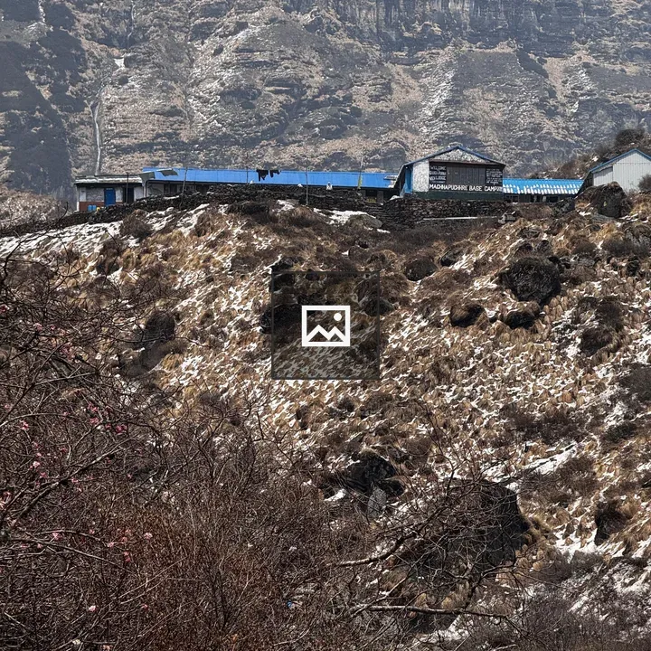 Mountain ridge with blue-roofed buildings