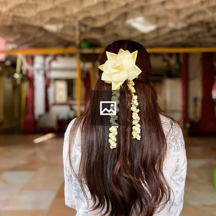 Back view of a person with flower hair accessory