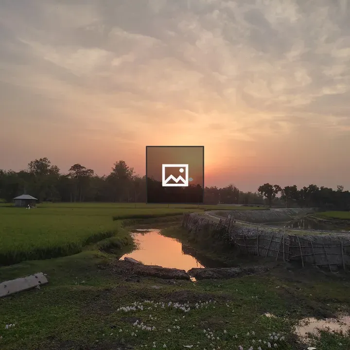 Afternoon field with water reservoir