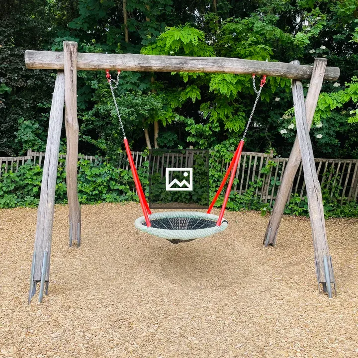 Rustic wooden swing set at zoo