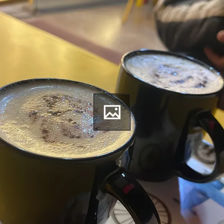 Two black mugs with coffee