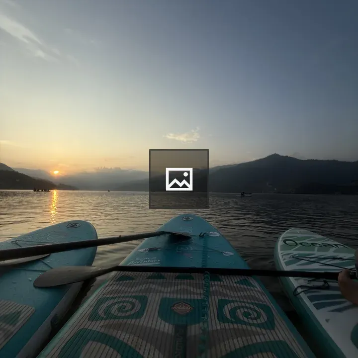 Sunset Over Water with Paddleboards