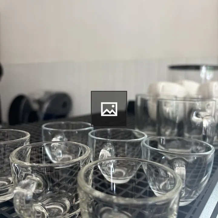 Glass cups on grid surface