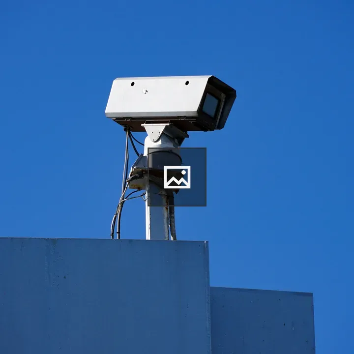 Security camera on blue building