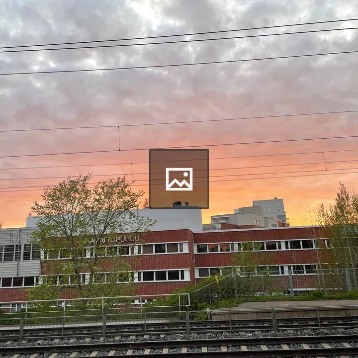 Evening Building by Rail Tracks