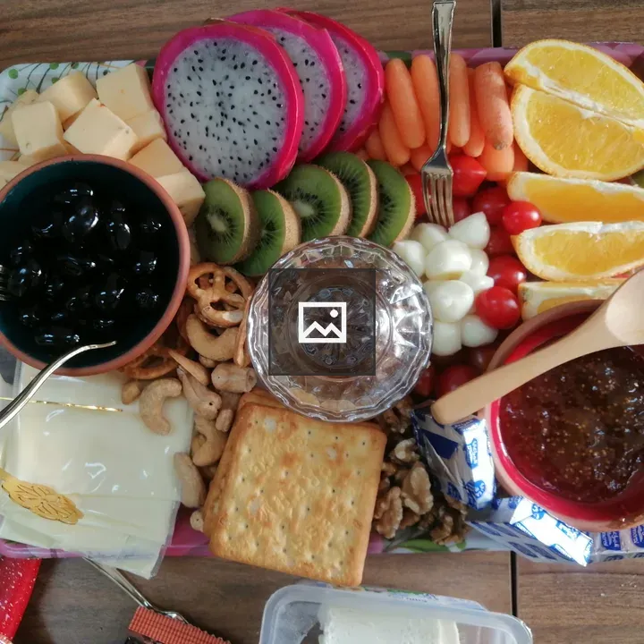 Colorful platter of mixed snacks and fruits