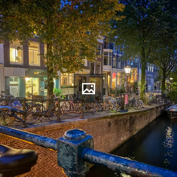 Canal scene with bicycles and boats