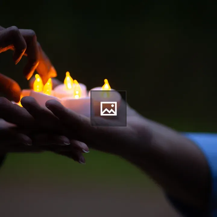 Candle with Hands in Ceremony