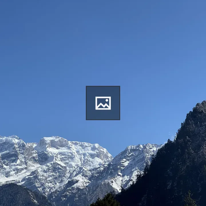 Snowy mountains under blue sky