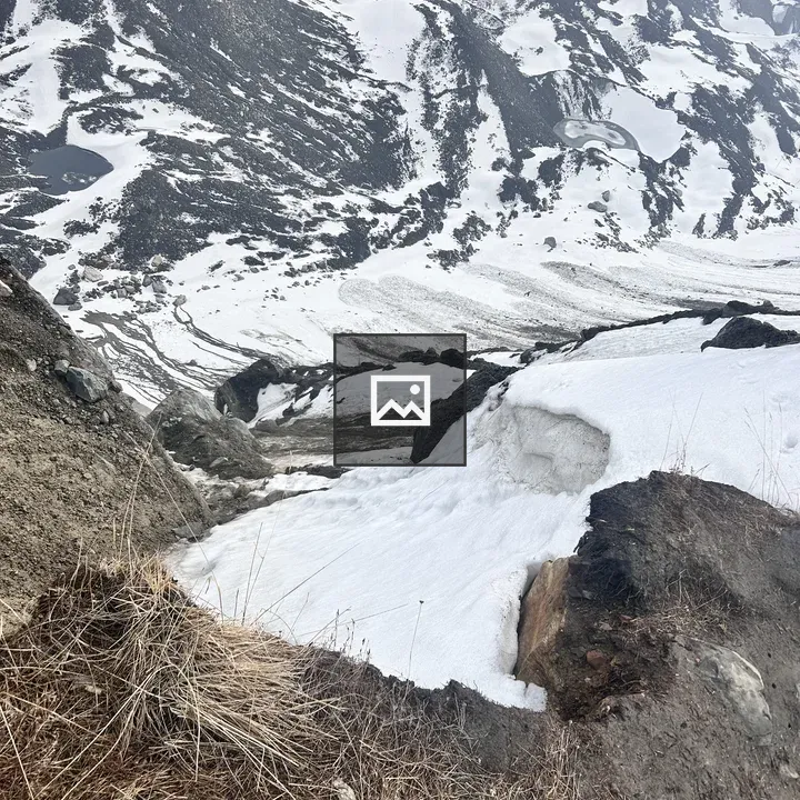Snowy hills with a pond