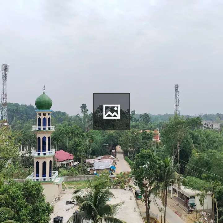 Tall minaret with green dome