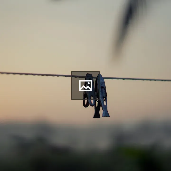 Pegs Hanging on Rope