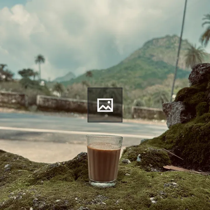 Glass of tea on mossy rock