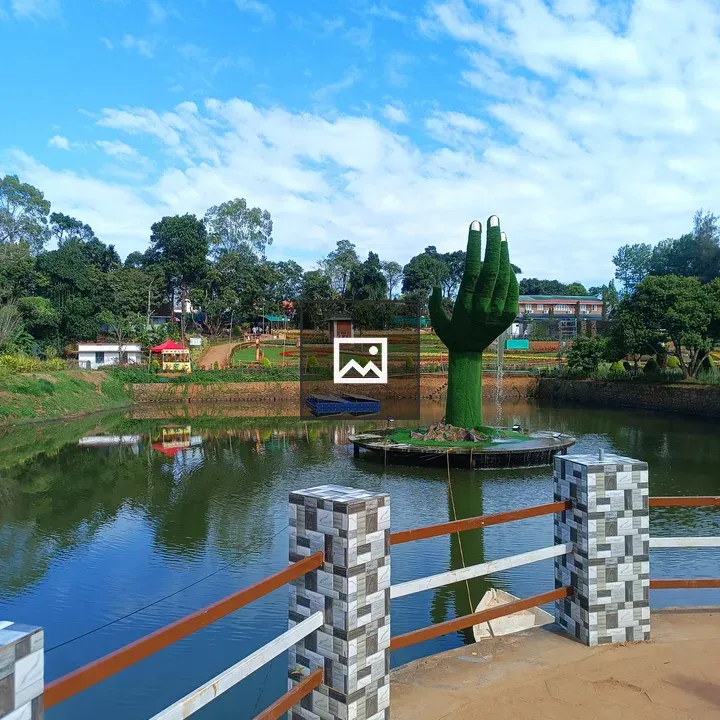Park scene with green hand statue