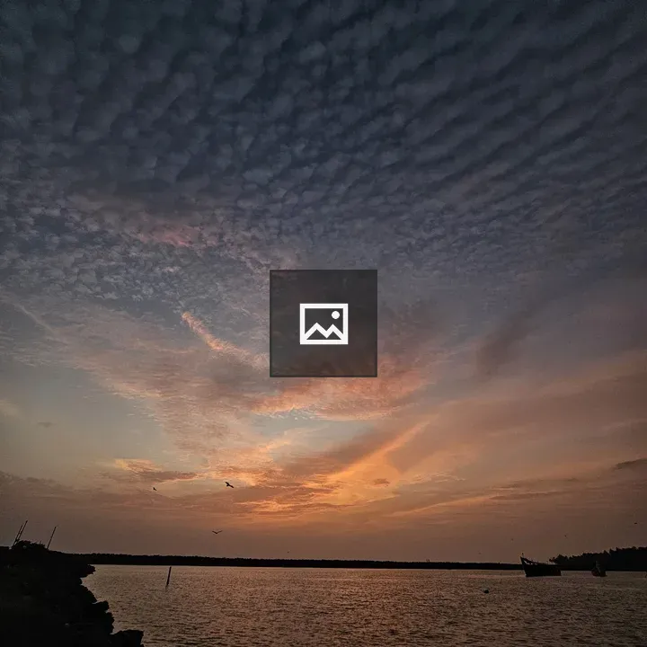 Evening sky over boats on water