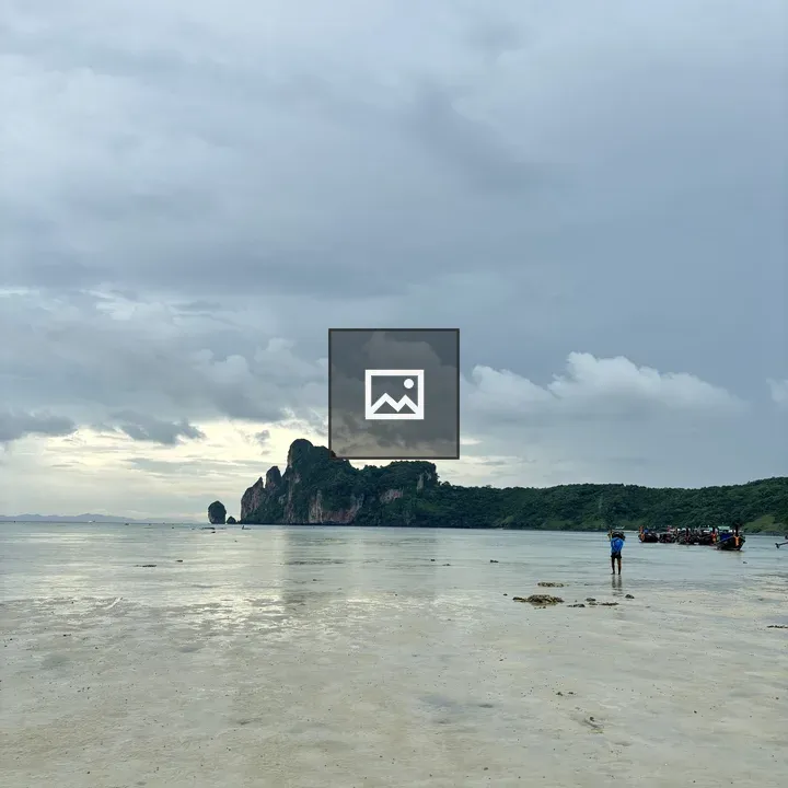 Serene Beach Scene with Distant Boat