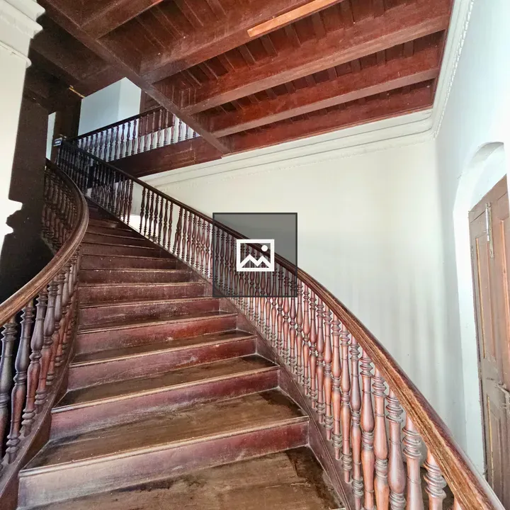 Wooden staircase with carved handrails