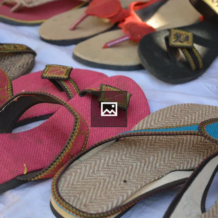 Colorful jute slippers in village setting