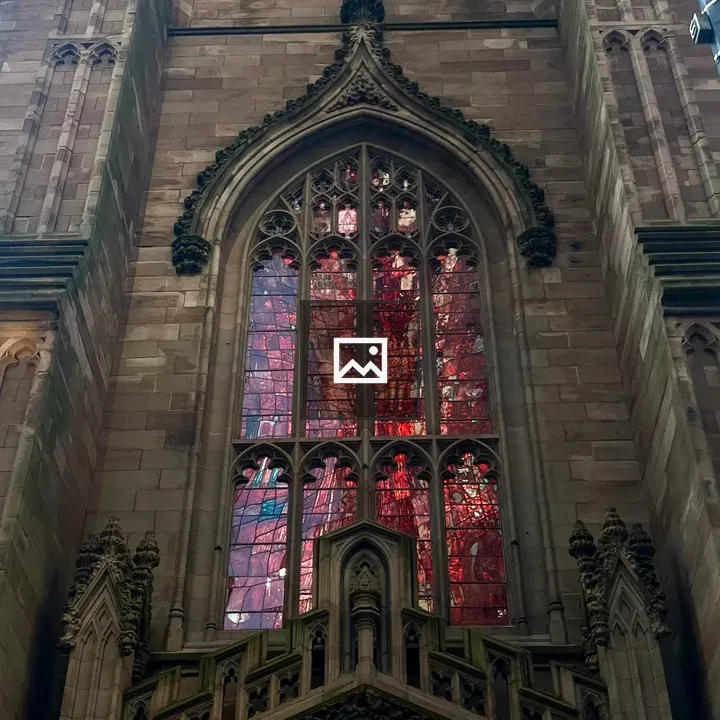 Gothic church facade with red window