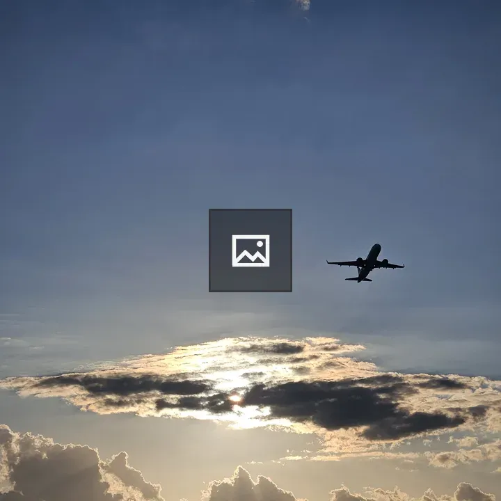 Silhouette of Airplane at Sunset