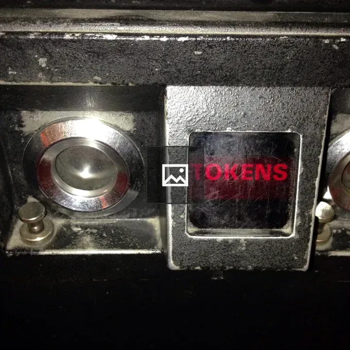 Arcade token slot