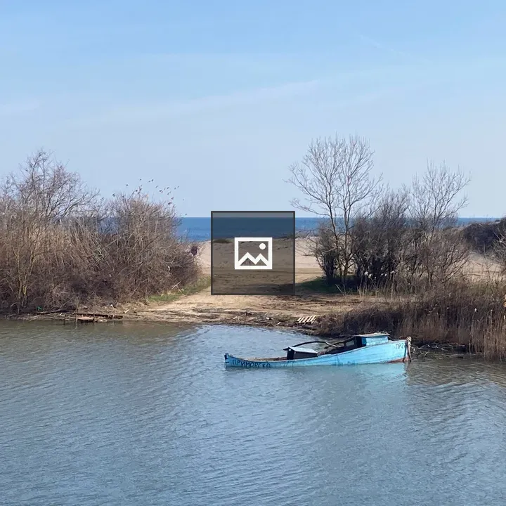 Blue Boat Moored on Calm Water