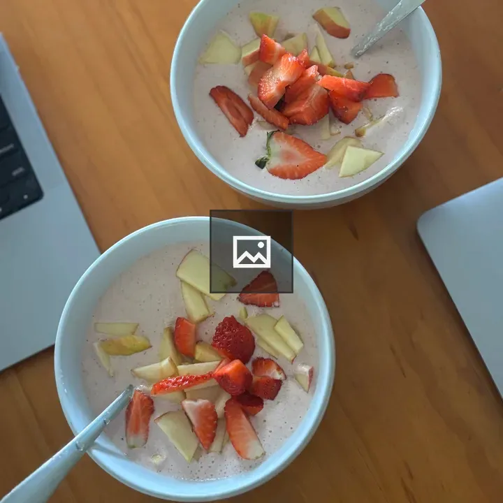 Two bowls of creamy fruit dish