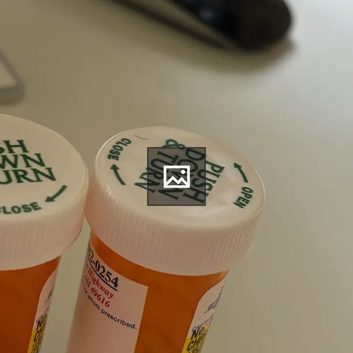 Caps of two medicine bottles