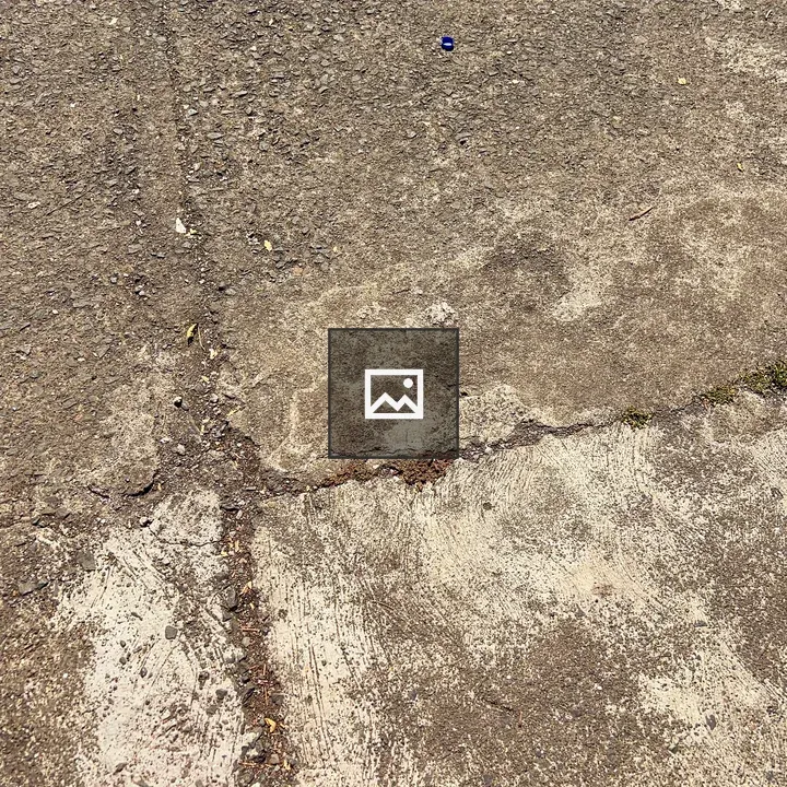 Cracked concrete ground top-down