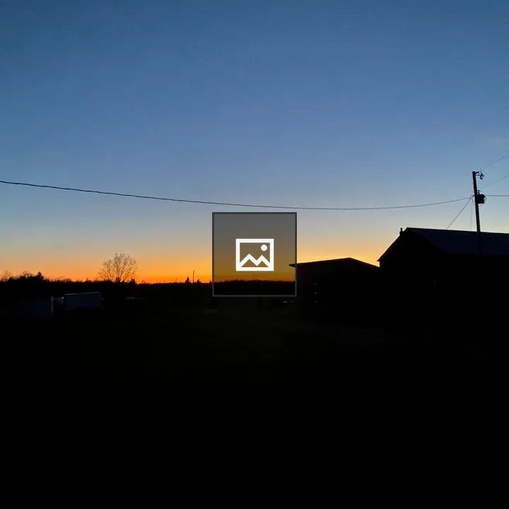 Evening sky over barn silhouette