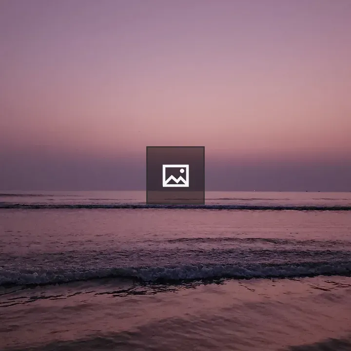 Sunset over violet sea horizon
