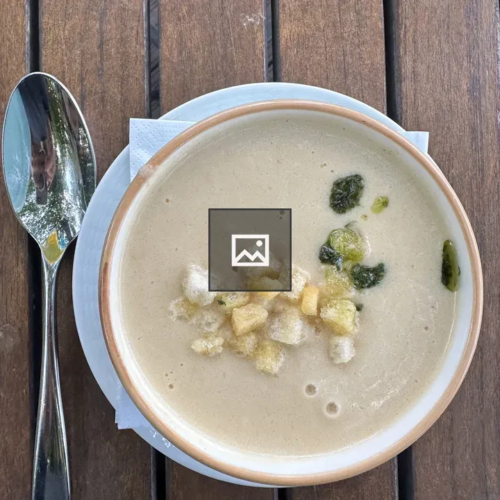 Creamy soup in ceramic bowl