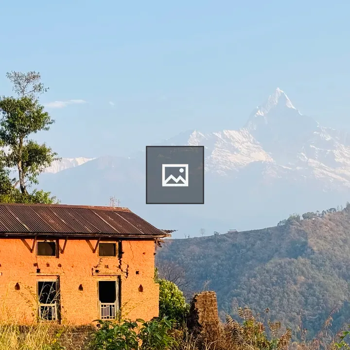 Rustic brick house with mountains