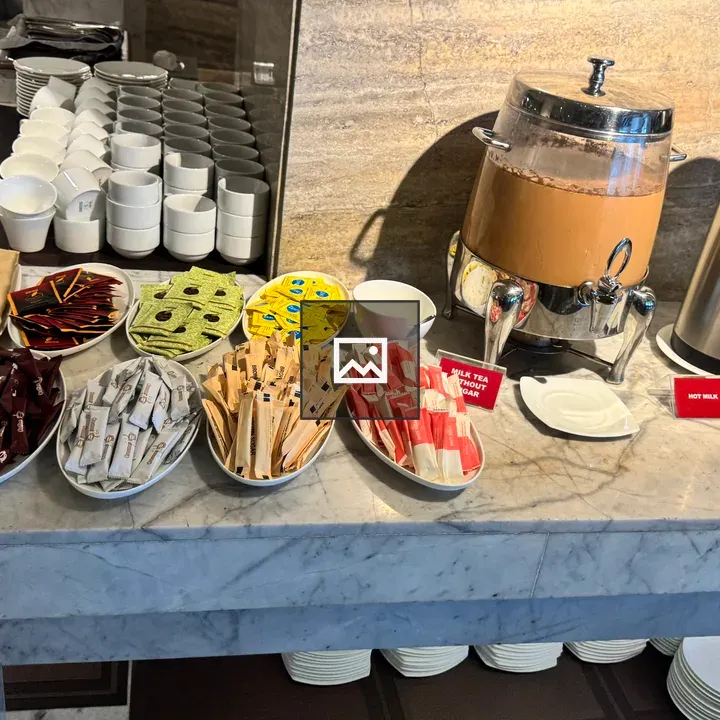 Buffet Table with Milk Tea and Snacks