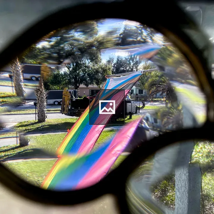 Progress Pride Flag by Window