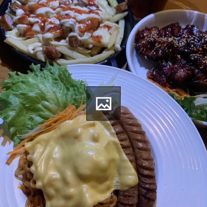 Plate with grilled sausages and noodles