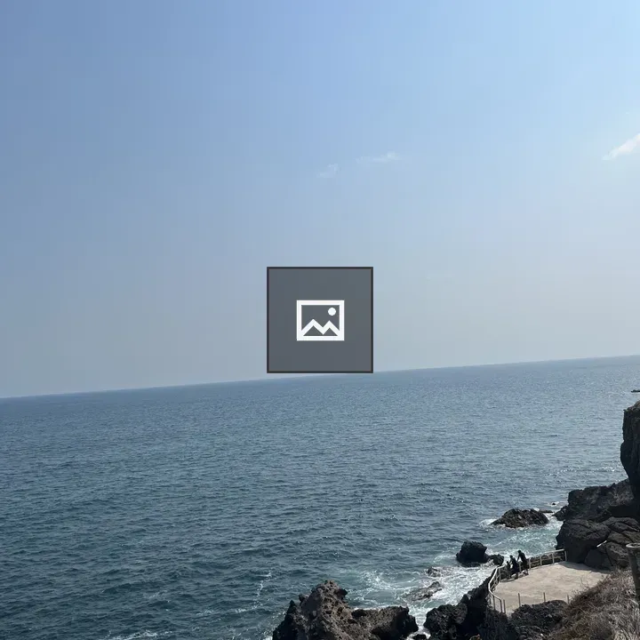 Rocky coastline at blue horizon