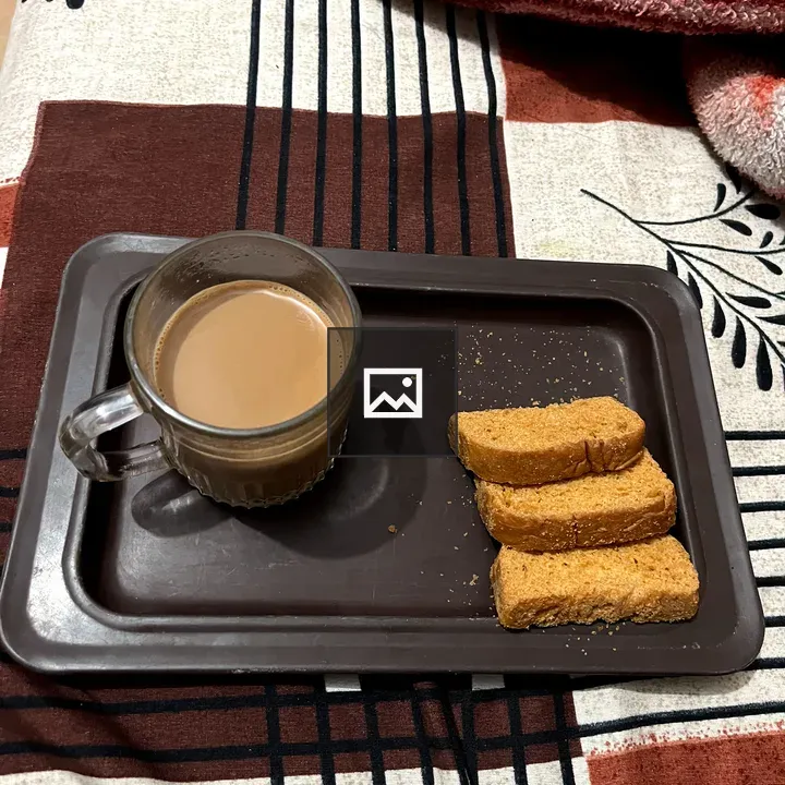 Tea in a brown tray with biscuits