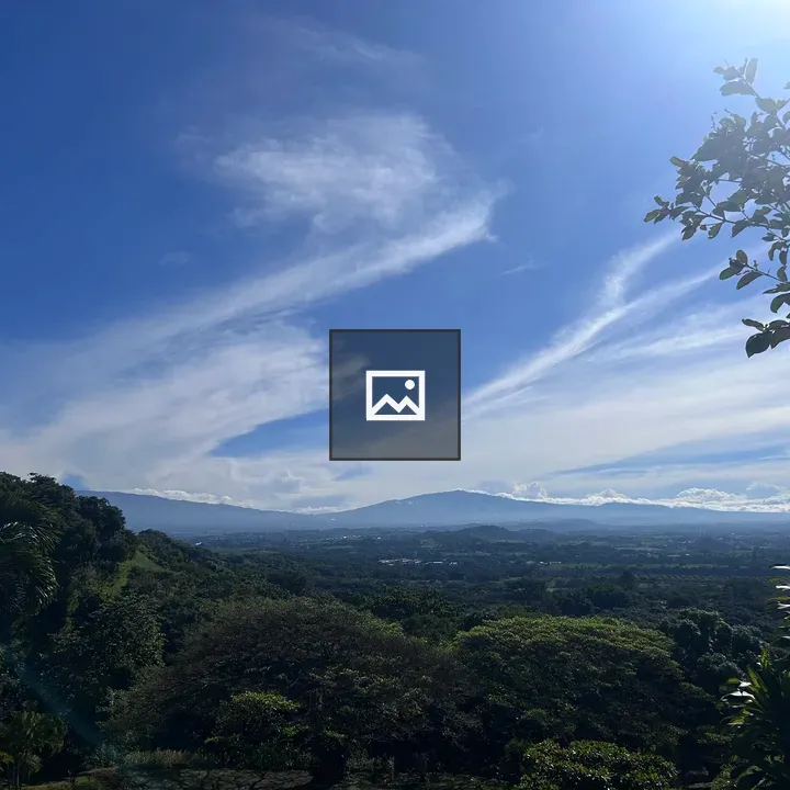 Panorama of blue sky over green hills