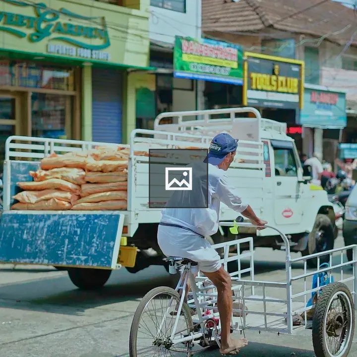 Man with bicycle on road