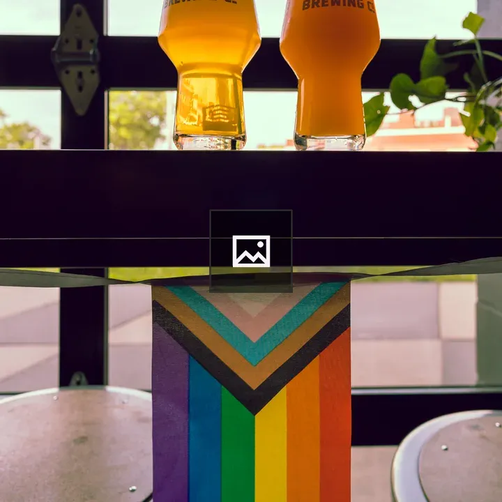 Two beers on a ledge