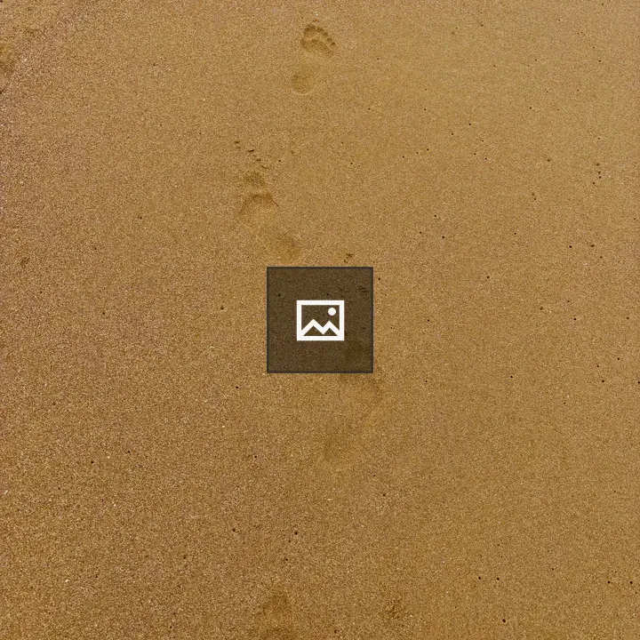 Footprints on Sandy Beach