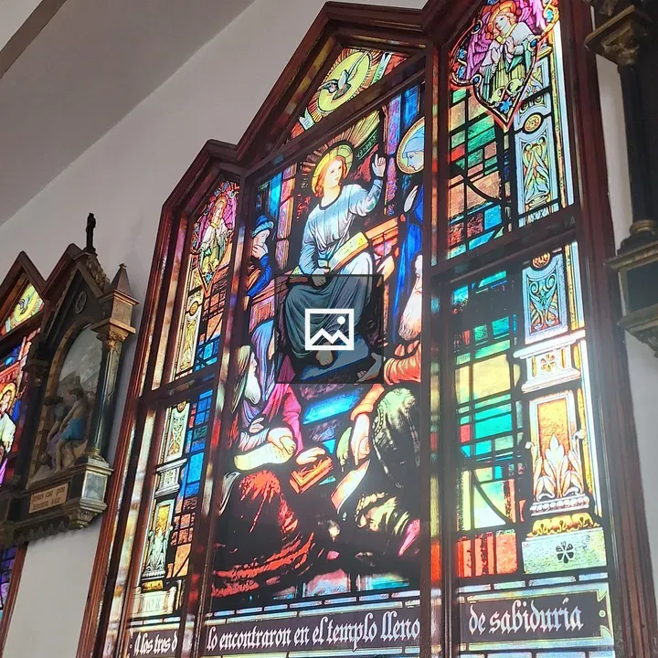 Stained glass window with central figure