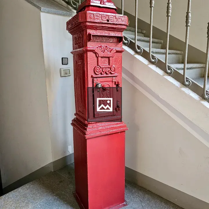 Vintage red post box indoors