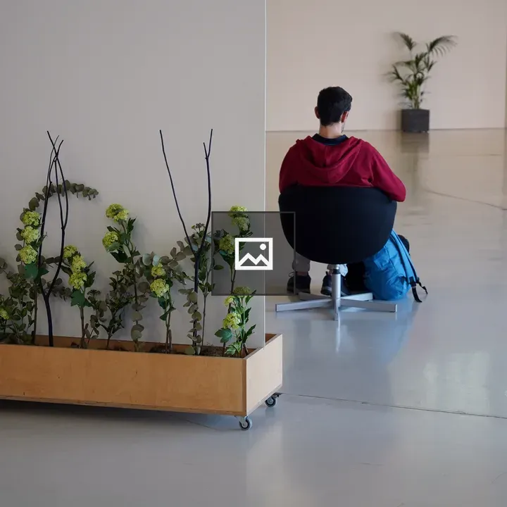 Person in red hoodie in open space