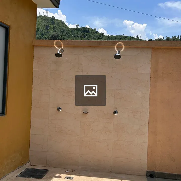 Outdoor shower area with two heads