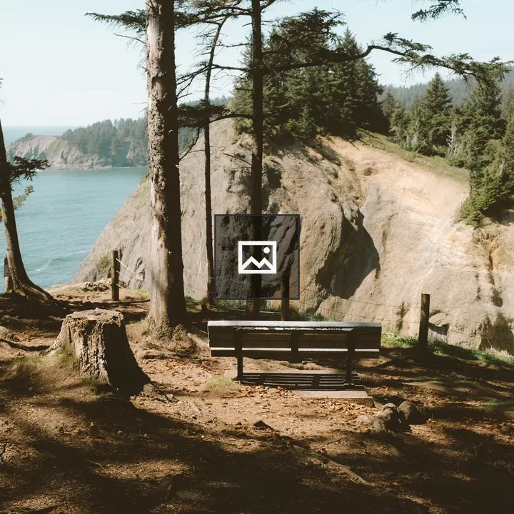 Wooden bench by the coastline