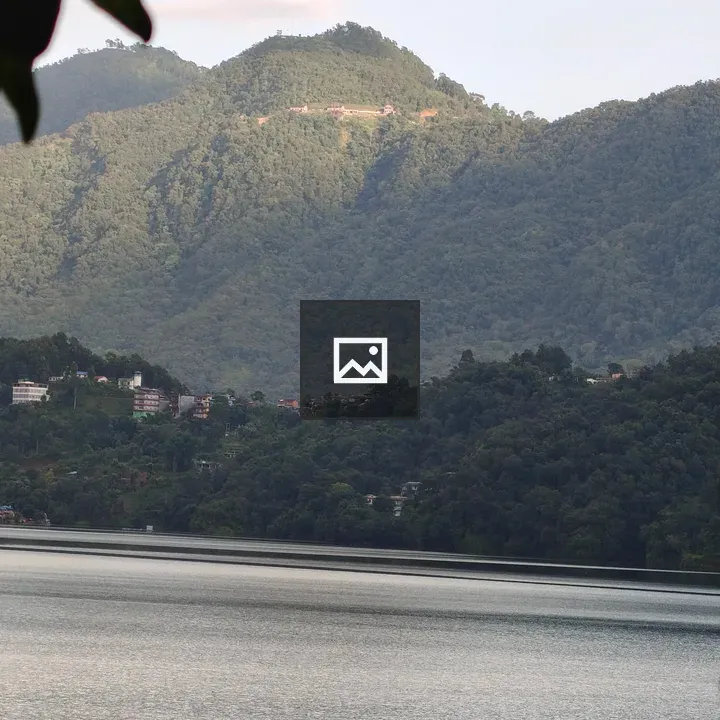 Peaceful lake with small boat