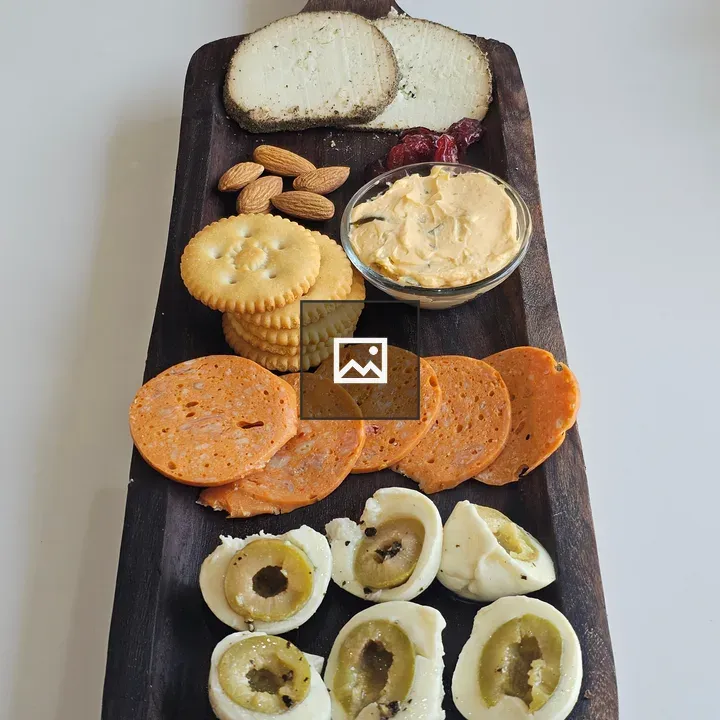 Dark wooden serving platter with deli board