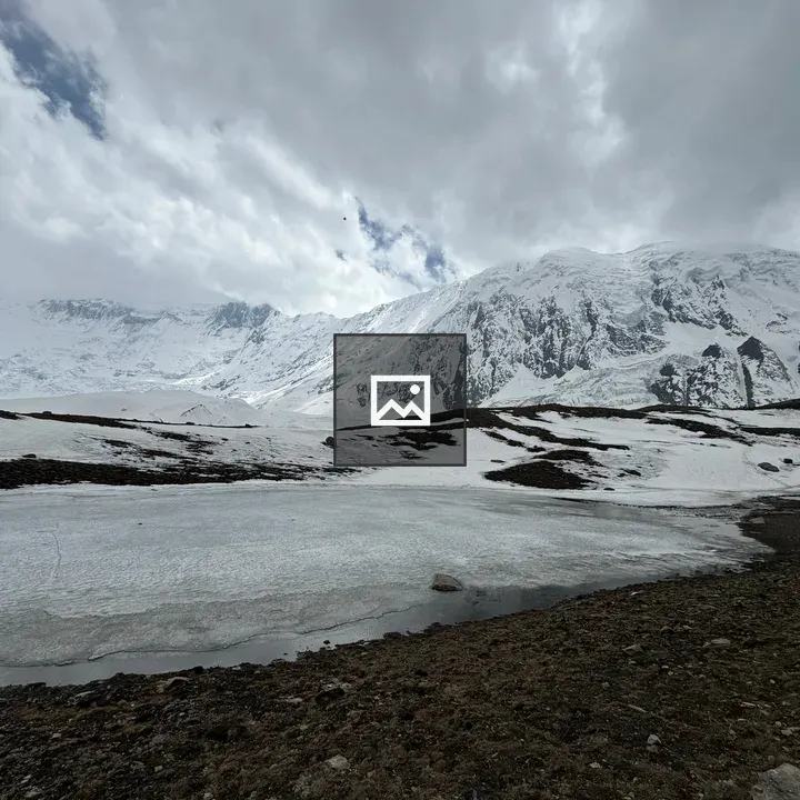 Glacial Lake with Snowy Ridge